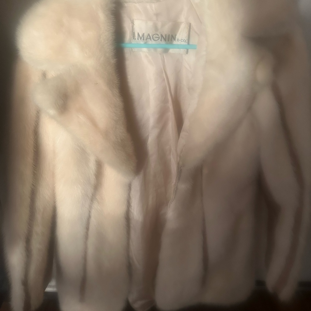 Light beige off white with vertical brown line designed fur.